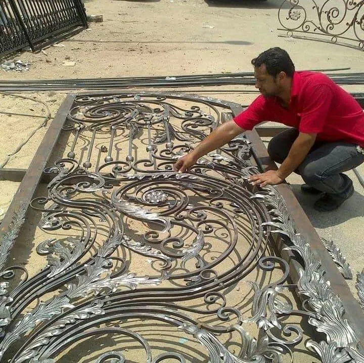 Workers welding steel frame